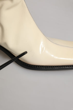 Dolce & Gabbana Kniehohe Stiefel aus weißem und schwarzem Leder