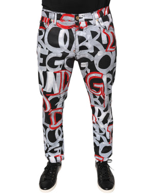 Dolce & Gabbana Skinny Jeans aus Baumwoll-Denim mit mehrfarbigem Monogramm-Print