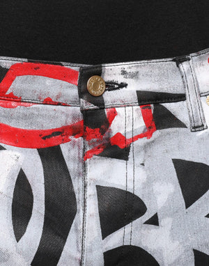 Dolce & Gabbana Skinny Jeans aus Baumwoll-Denim mit mehrfarbigem Monogramm-Print
