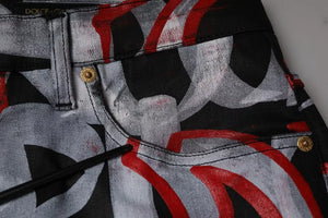 Dolce & Gabbana Skinny Jeans aus Baumwoll-Denim mit mehrfarbigem Monogramm-Print
