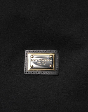 Dolce & Gabbana Schwarze ärmellose Jacke mit Kapuze und Logo-Plakette